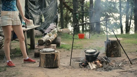 The kettle is warmed on the campfire Stock Footage 94013762