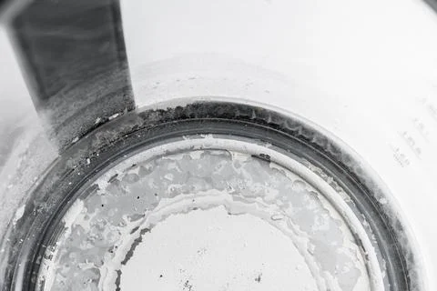 Kettle with white limescale surface - hard water concept Stock Photos