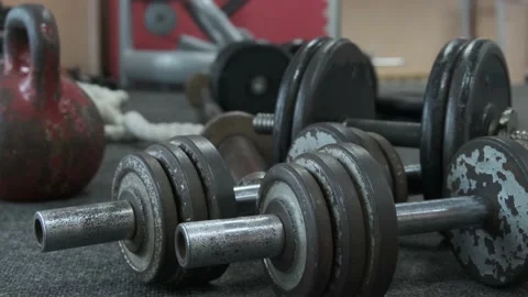 Kettlebell and dumbbell weight training gym Stock Footage 218018980