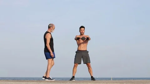 Kettlebell exercise with coach Stock Footage