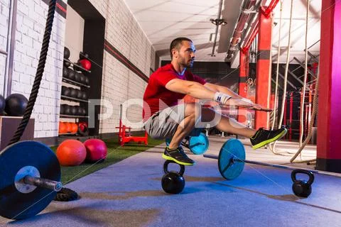 Kettlebell man pistol squat balance at gym Stock Photos