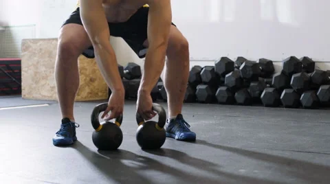 Kettlebell squats - young man doing functional workout at the gym Stock Footage 65280063