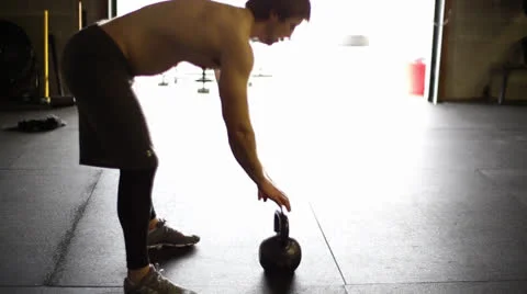 Kettlebell Swing in the Light Stock Footage 22994703