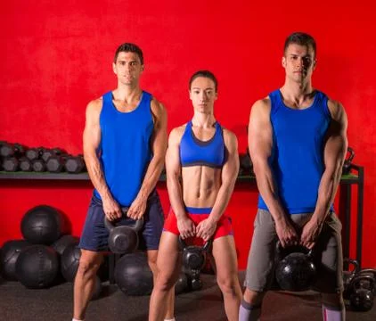 Kettlebell swing workout training group at gym Stock Photos