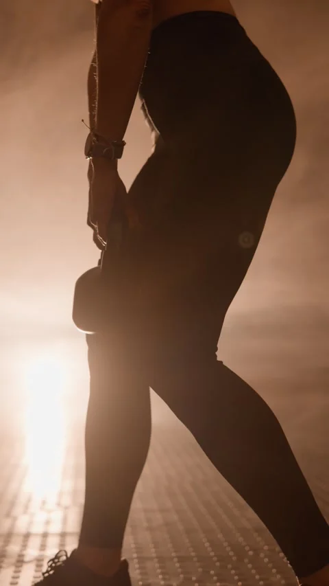 Kettlebell training to develop strength and strengthen core muscles. Female Stock Footage 272634595