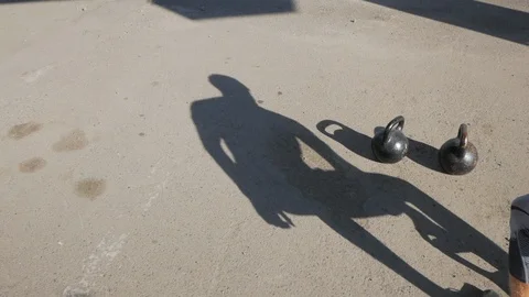 Kettlebells exercises outdoors Stock Footage 97532225