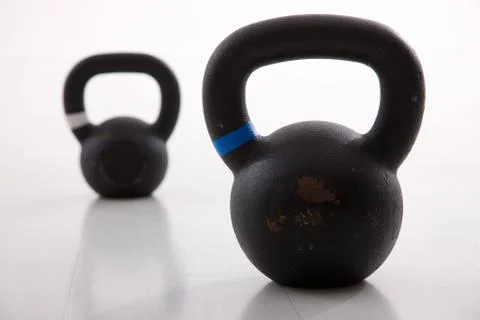 Kettlebells weights in a workout gym Stock Photos