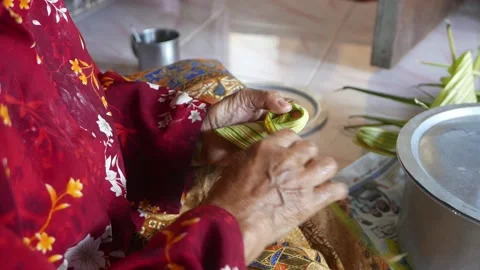 Ketupat or rice dumpling making process Stock Footage 135966402