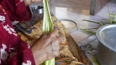 Ketupat or rice dumpling making process Stock Footage 135966607