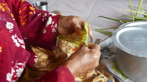 Ketupat or rice dumpling making process Stock Footage 135966882