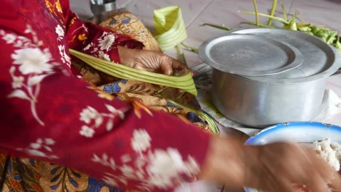 Ketupat or rice dumpling making process Stock Footage 135967570