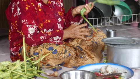 Ketupat or rice dumpling making process Stock Footage 135968093