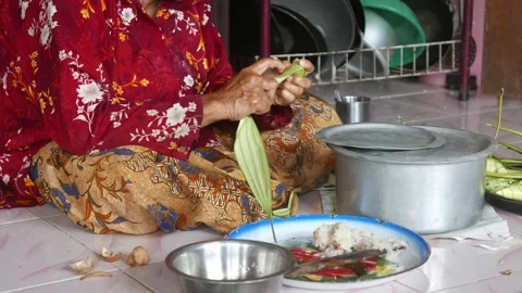 Ketupat or rice dumpling making process Stock Footage 135968427