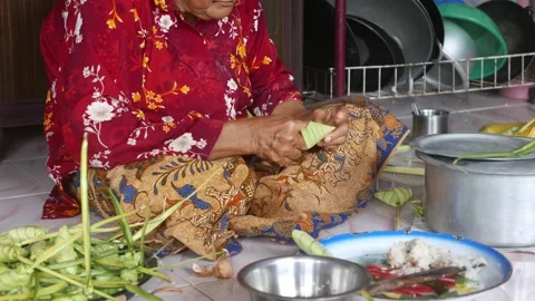 Ketupat or rice dumpling making process Stock Footage 135968524