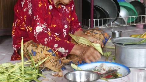 Ketupat or rice dumpling making process Stock Footage 135968634
