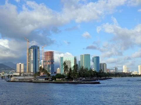 Kewalo Basin point, construction cranes, and surrounding condos Stock Photos