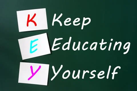 Key acronym -keep educating yourself on a blackboard with sticky notes Stock Photos