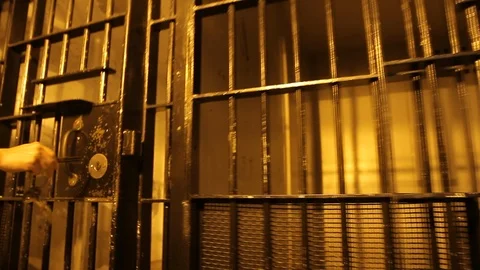 Key Being Turned in Jail Cell Door HD Vi... | Stock Video | Pond5