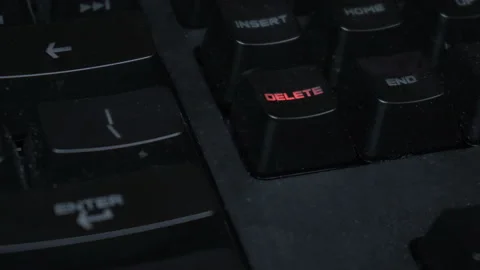 Key blinks delete on glowing computer keyboard 스톡 동영상 102836580