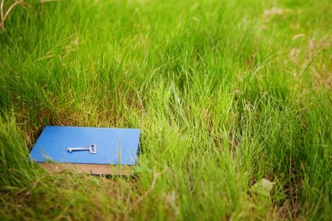 Key on the book outside Stock Photos