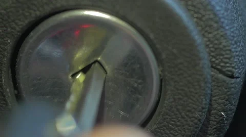 Key Into Car Ignition Start Engine Extreme Closeup Stock-Footage 65769773
