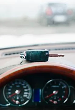 Key of the car lock is located on the dashboard Stock Photos