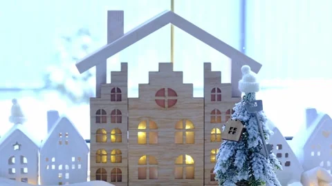Key on Christmas tree and tiny house on cozy home with Christmas decor on t.. Stock Footage 262364285