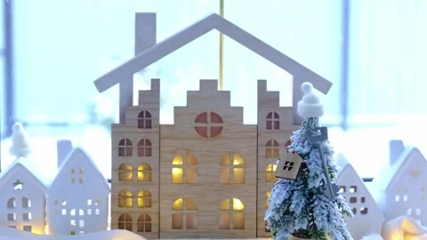 Key on Christmas tree and tiny house on cozy home with Christmas decor on t.. Stock Footage 262413736
