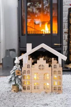 Key on Christmas tree and tiny house on cozy home with Christmas decor near.. Foto stock