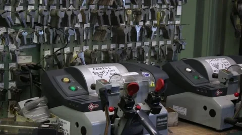 Key cutter machine in front of key display on wall at local shop Stock Footage 45564032