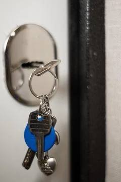 The key to the door is inserted into the keyhole Stock Photos