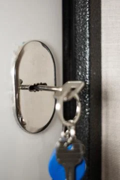 The key to the door is inserted into the keyhole Stock Photos