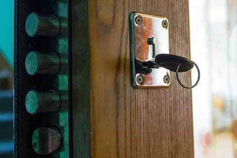 The key is in the door lock. Stock Photos