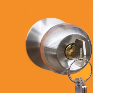 The key is in the door lock. Stock Photos