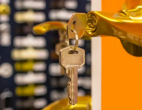 The key is in the door lock. Stock Photos