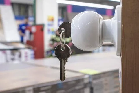 The key is in the door lock. Stock Photos