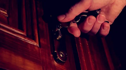 Key in the door.metal keys in a mans hand. mans hand opens a hotel room. Stock Footage 292920058
