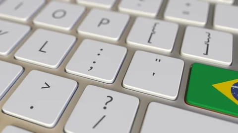 Key with flag of Brazil on the computer keyboard switches to key with flag of Stock Footage 109461037