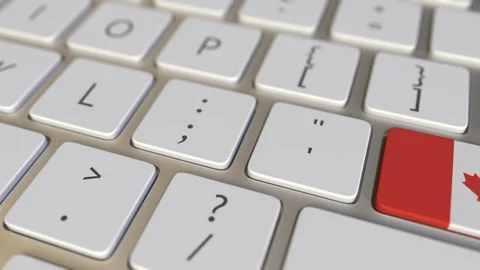 Key with flag of Canada on the computer keyboard switches to key with flag of Stock Footage 109460982