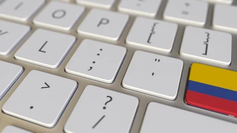 Key with flag of Colombia on the computer keyboard switches to key with flag of Stock Footage 109215680