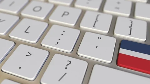 Key with flag of the Dominican Republic on the computer keyboard switches to key Stock Footage 109454725