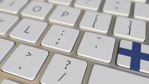 Key with flag of Finland on the computer keyboard switches to key with flag of Stock Footage 109111564