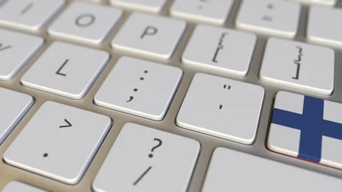 Key with flag of Finland on the computer keyboard switches to key with flag of Stock Footage 109454430