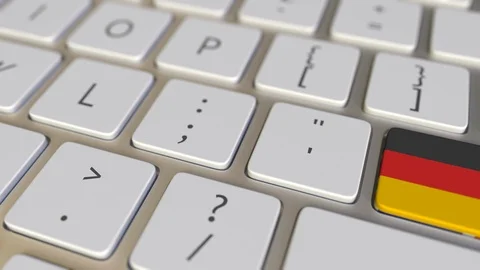 Key with flag of Gemany on the computer keyboard switches to key with flag of Stock Footage 109214065