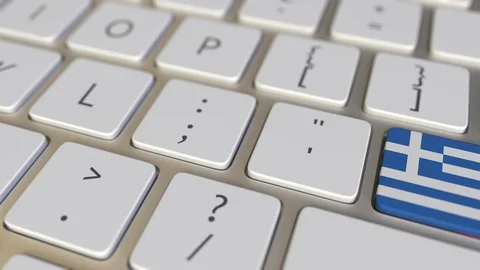 Key with flag of Greece on the computer keyboard switches to key with flag of Stock Footage 109111147