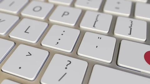Key with flag of Japan on the computer keyboard switches to key with flag of Stock Footage 109282667