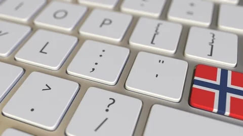 Key with flag of Norway on the computer keyboard switches to key with flag of Stock Footage 109109533
