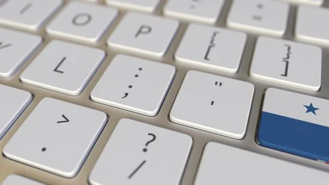 Key with flag of Panama on the computer keyboard switches to key with flag of Stock Footage 109211385