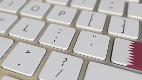 Key with flag of Qatar on the computer keyboard switches to key with flag of the Stock Footage 109108064