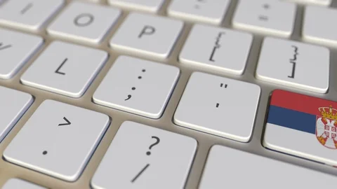 Key with flag of Serbia on the computer keyboard switches to key with flag of Stock Footage 109210674